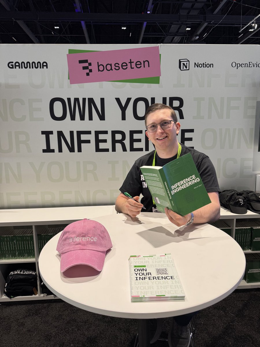 Baseten booth with Philip Kiely showing his Inference Engineering book