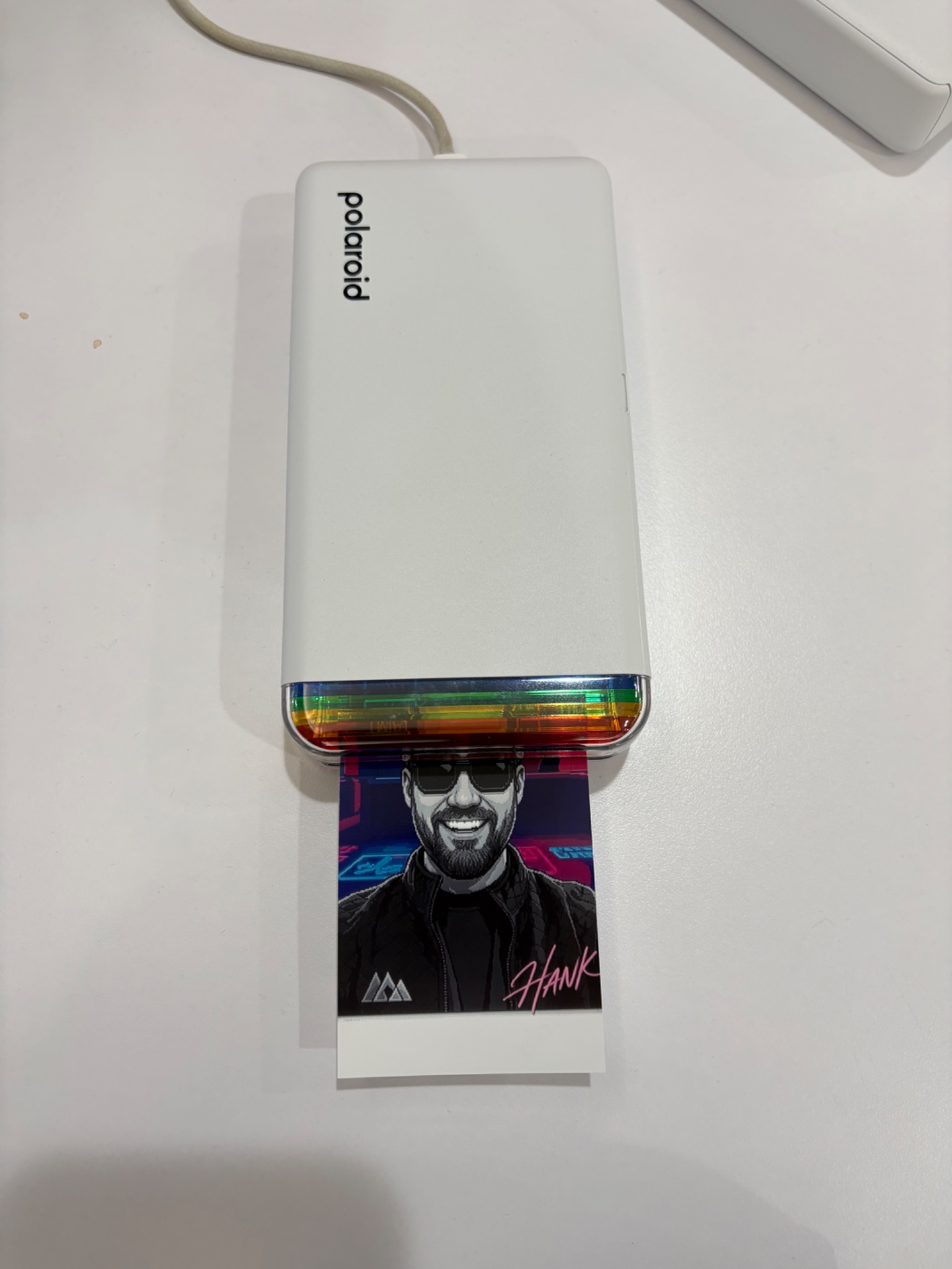 Vercel Polaroid printer printing custom pixel art portrait at React Miami